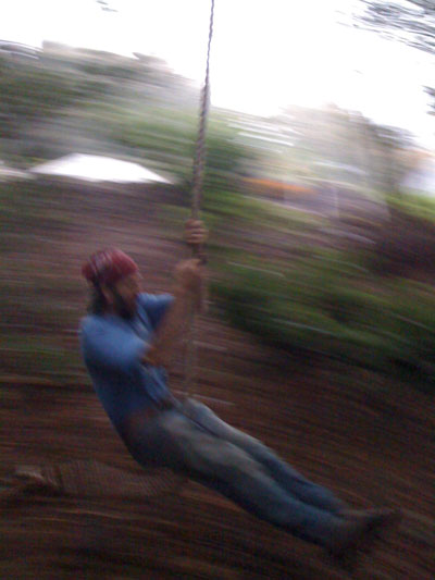 Elmo swinging on the rope swing