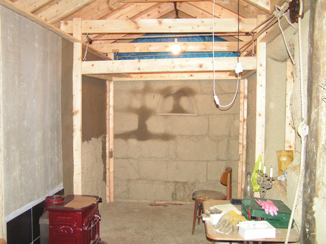 The bed, hoisted up to the ceiling.