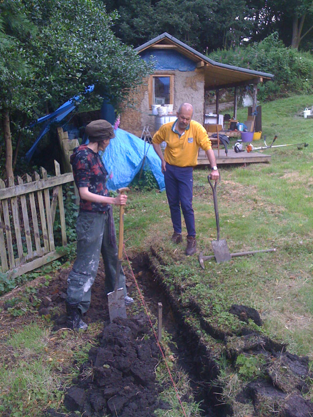 Hazel and Bob digging a trench