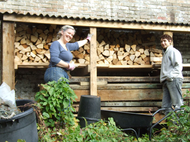 Grace and Anna by the woodpile