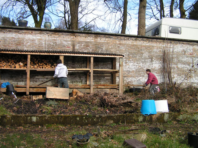 Anna and Sam sorting the wood