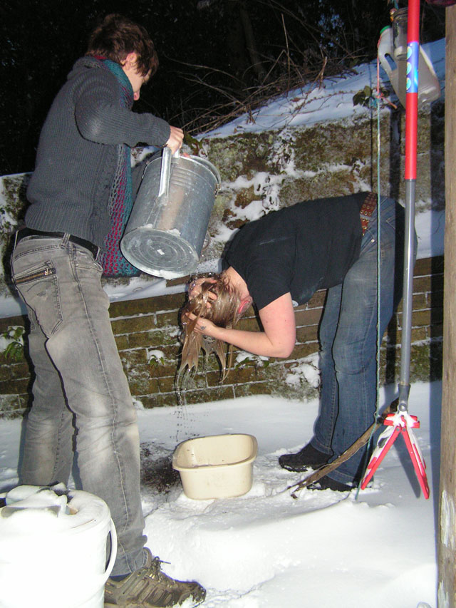 grace washing her hair in the snow