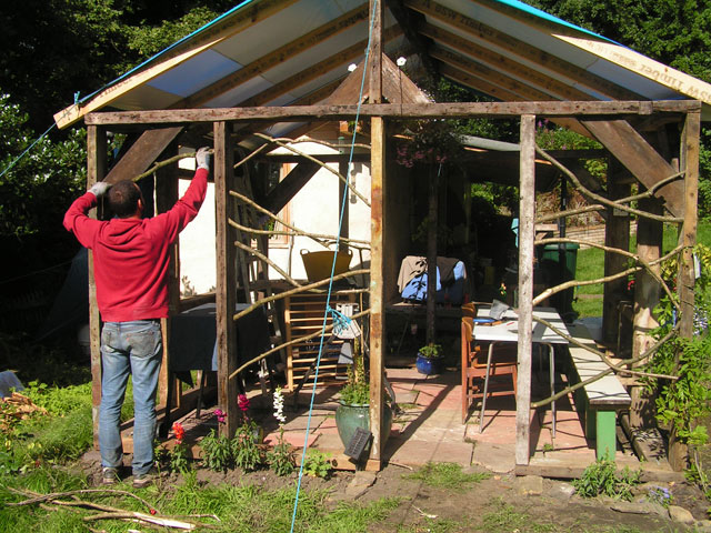 Francesco adding walls to the pergola