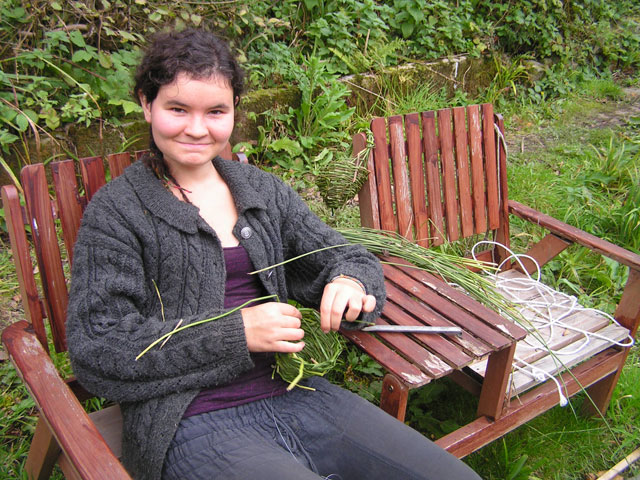 Nora making baskets out of reeds